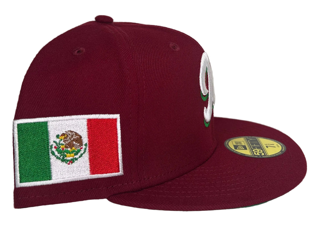 New Era Mexico Serie Del Caribe cardinal red 59Fifty fitted cap features a prominent embroidered "M" and a Mexican flag side patch.