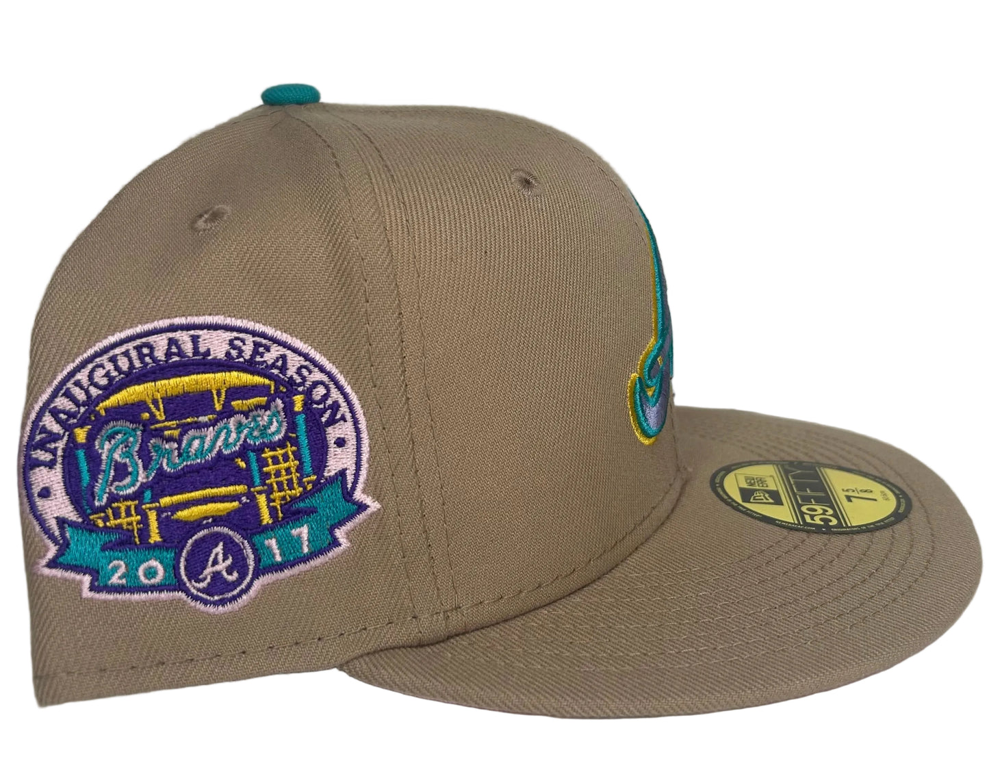 New Era Atlanta Braves 59FIFTY fitted hats from the Sandstorm Collection, featuring a tan colorway, a specialized side patch, and a vibrant pink under visor.