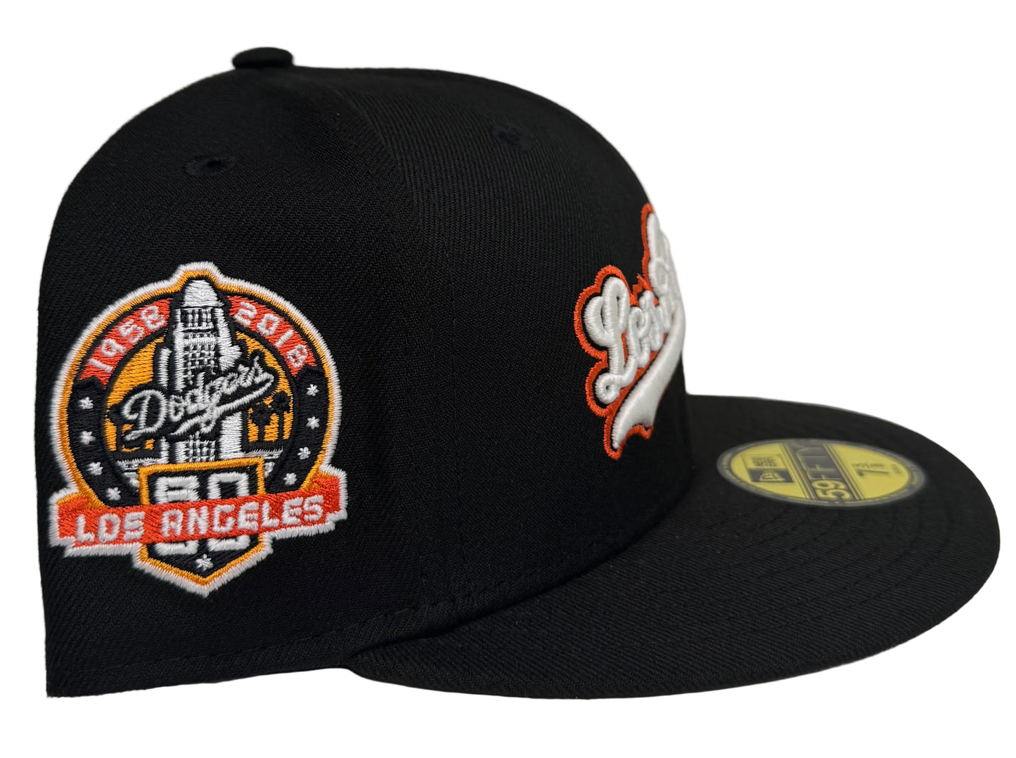 New Era 59FIFTY Los Angeles Dodgers fitted hat featuring a script logo and a celebratory side patch.