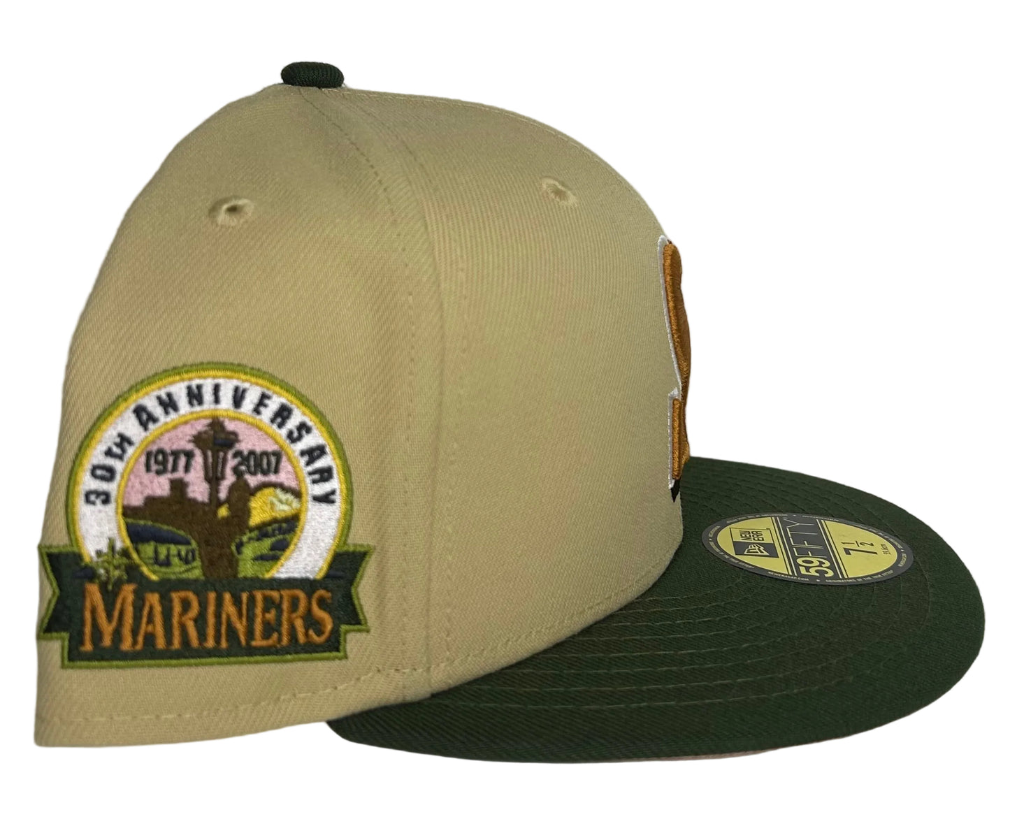 New Era Seattle Mariners "Vegas Strip" 59FIFTY fitted hat features a camel-colored crown, dark green visor, and a 30th Anniversary side patch.
