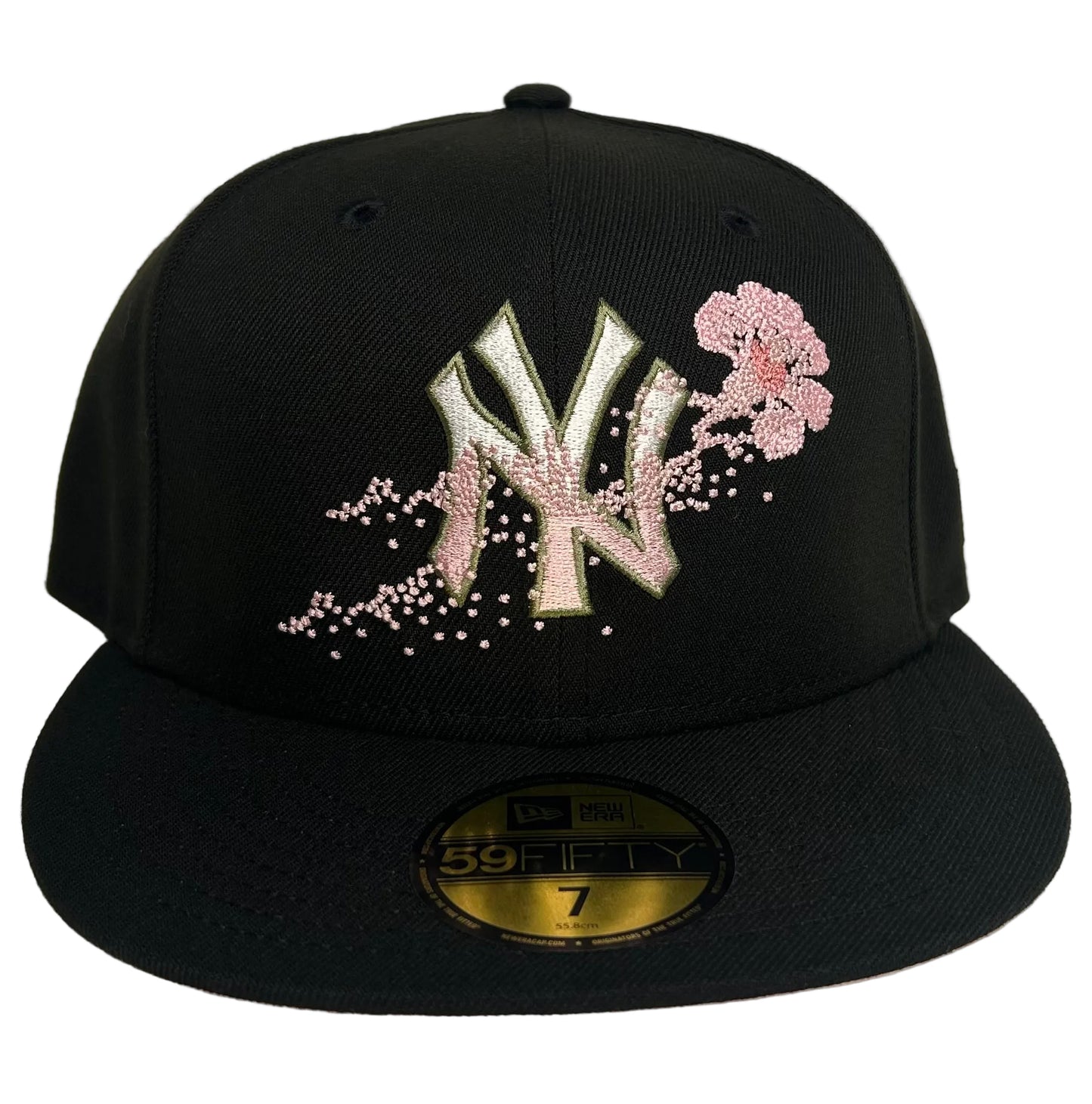 New Era 59FIFTY fitted hat features a black crown and a unique pink floral dotted Yankees logo.