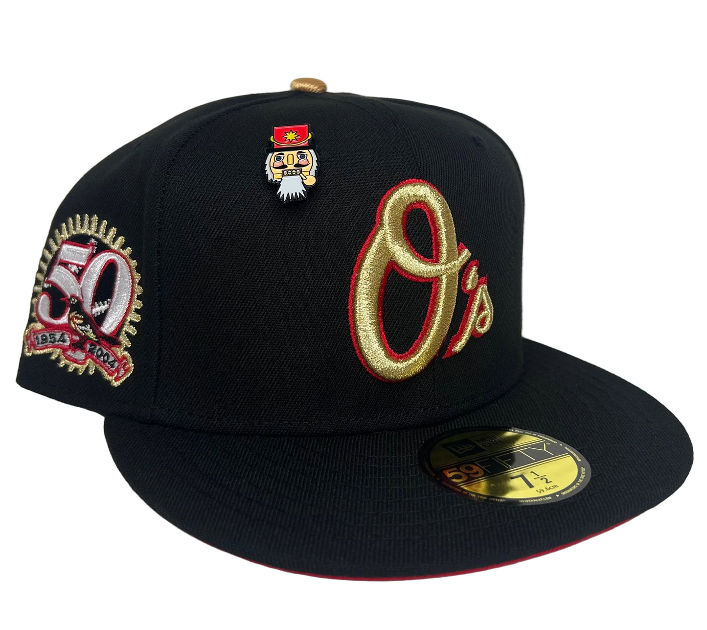 New Era Baltimore Orioles 59Fifty fitted hat features a black crown, a red undervisor, and a metallic gold "O's" logo on the front.