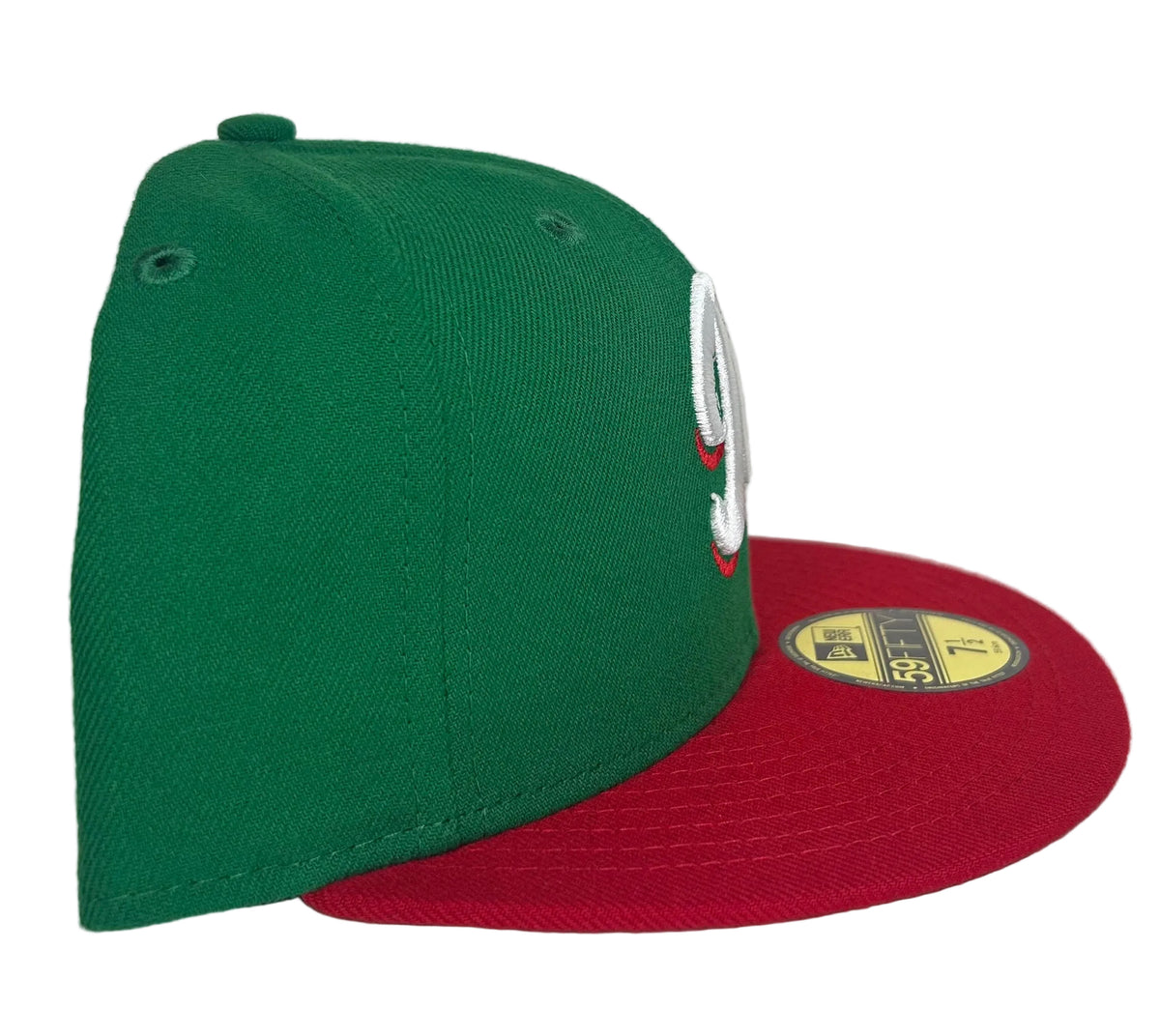 New Era 59FIFTY fitted cap features a vibrant green crown and a contrasting red visor with a white and red "M" logo for the Mexico Serie Del Caribe.