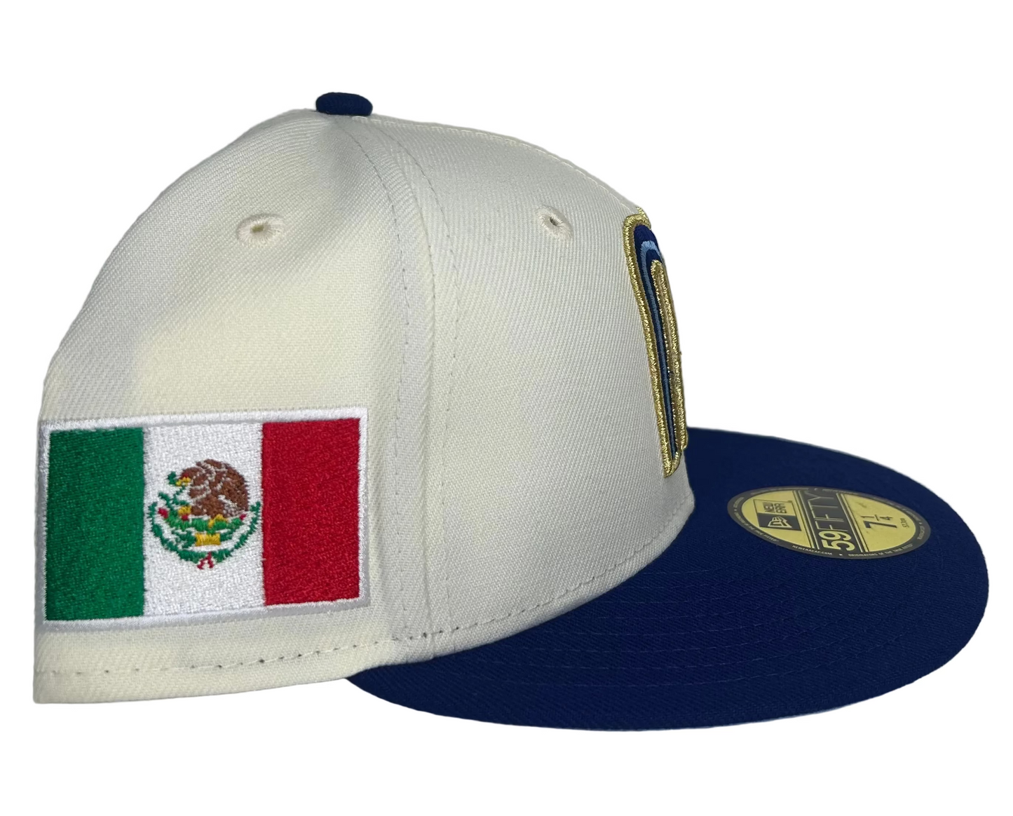 New Era 59FIFTY fitted hat features a two-tone design with a cream crown and royal blue visor.