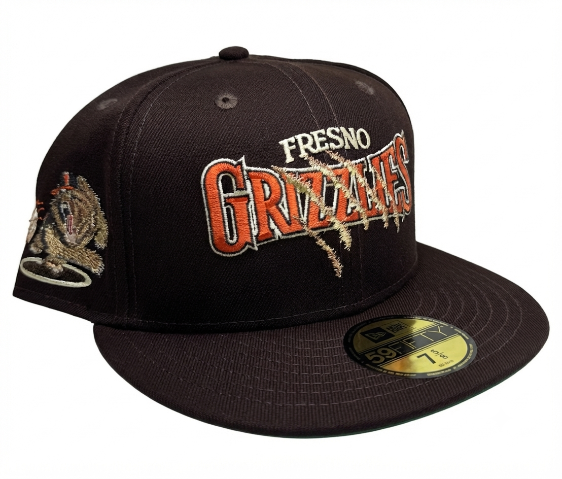 New Era Fresno Grizzlies fitted hat featuring a scratch-effect team logo and a green underbrim.