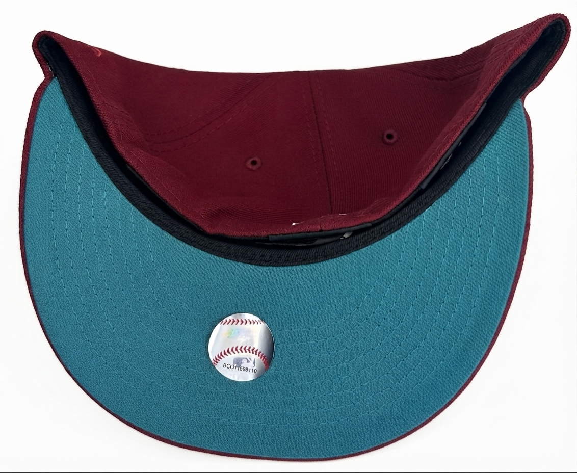 New Era 59FIFTY Arizona Diamondbacks fitted hat features a burgundy body and a 1998 inaugural season side patch.
