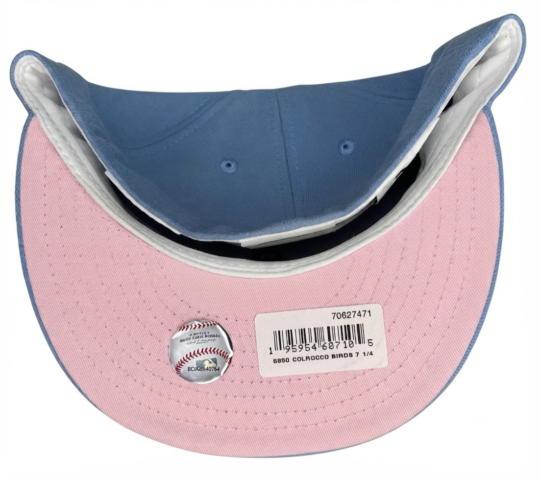 New Era Colorado Rockies "Cotton Candy" 59FIFTY fitted hat features a sky blue crown, a vibrant pink mountain logo on the front, and a special 25th-anniversary patch.