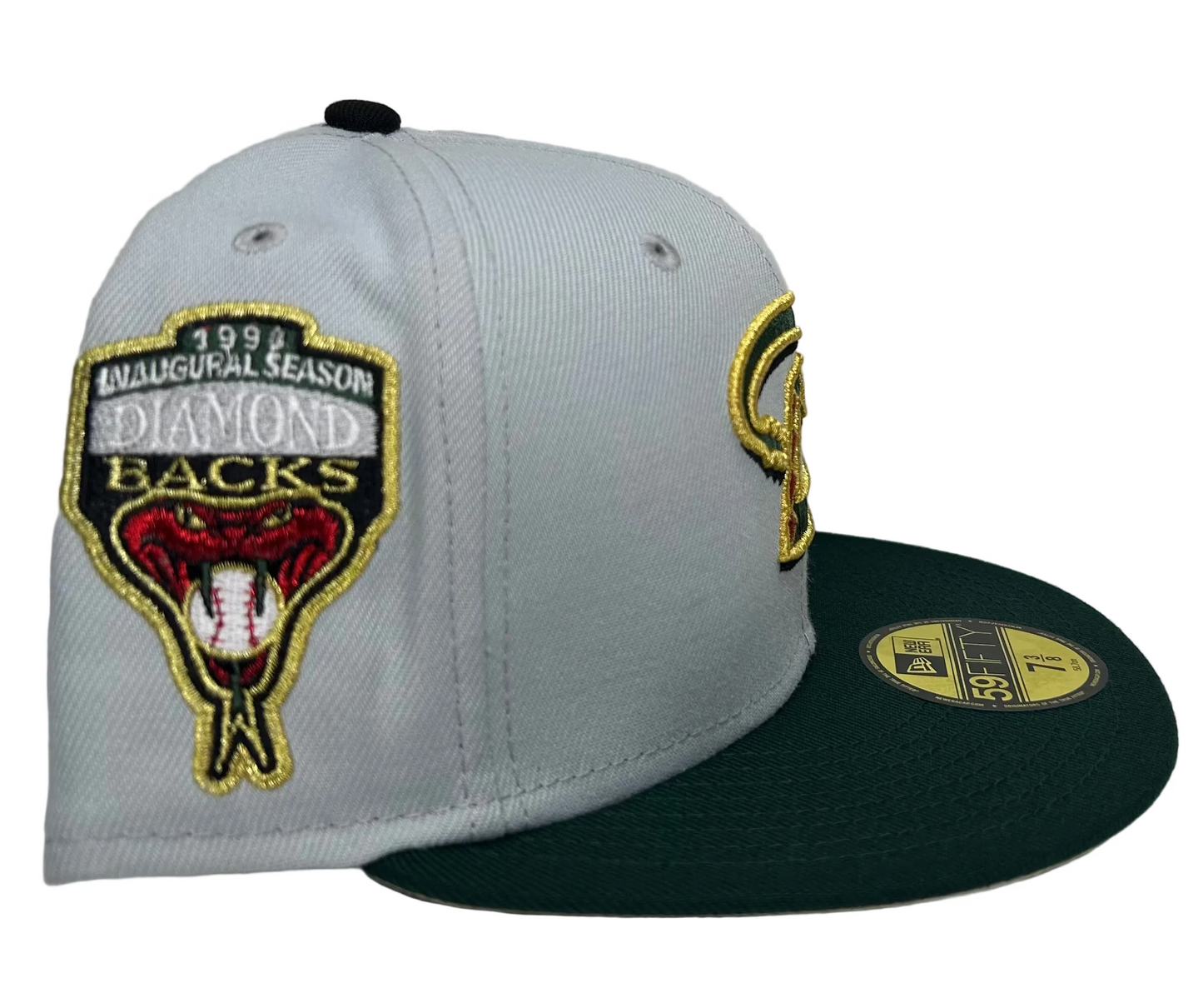 New Era 59FIFTY fitted hat features the Arizona Diamondbacks “Deku” Rahnni Fitteds in gold and green, with a matching 1998 inaugural season patch on the side.