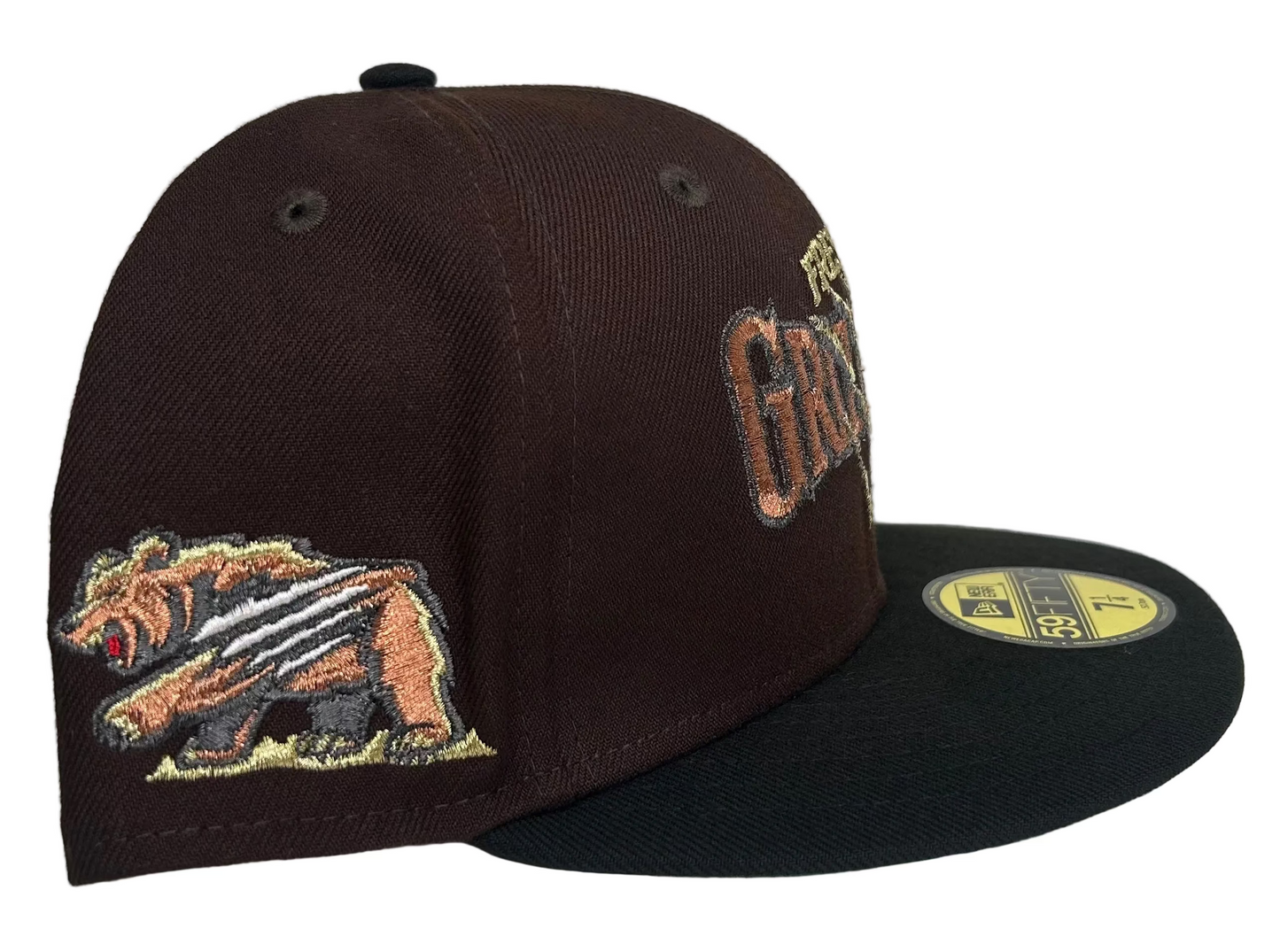 New Era Fresno Grizzlies 59Fifty fitted hat features a brown crown with a "clawed" logo and a contrasting black brim.