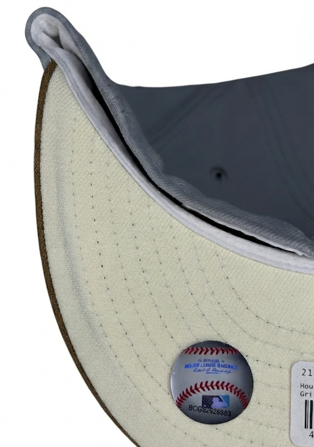 New Era Houston Astros 59FIFTY fitted hat from the "Autumn Storm" pack, featuring a gray crown, tan visor, and a 35th Anniversary Astrodome side patch.
