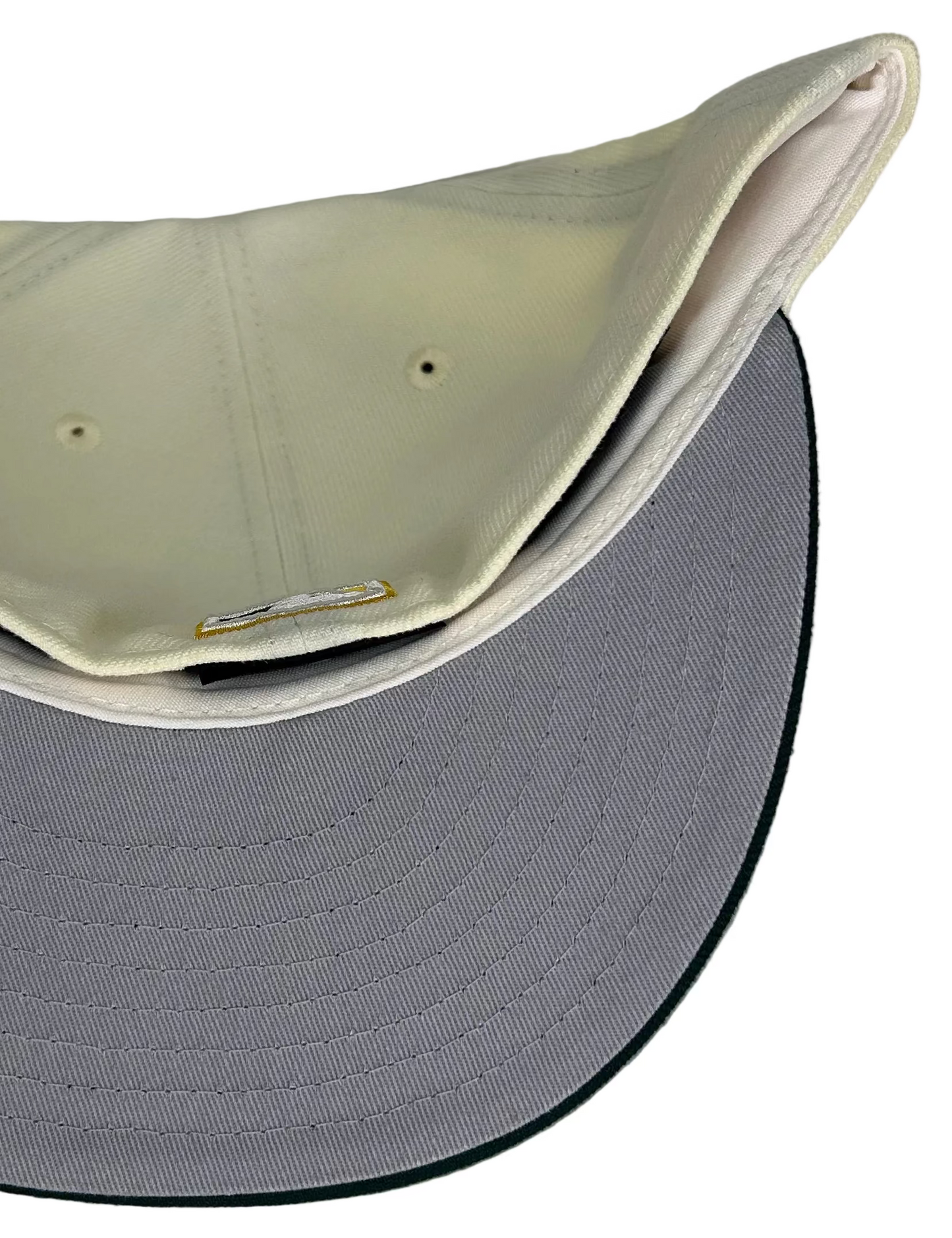 Off White Oakland Athletics 1987 All Star Game New Era 59Fifty Fitted hat featuring an off-white crown, dark green visor, and the classic elephant mascot logo on the front.