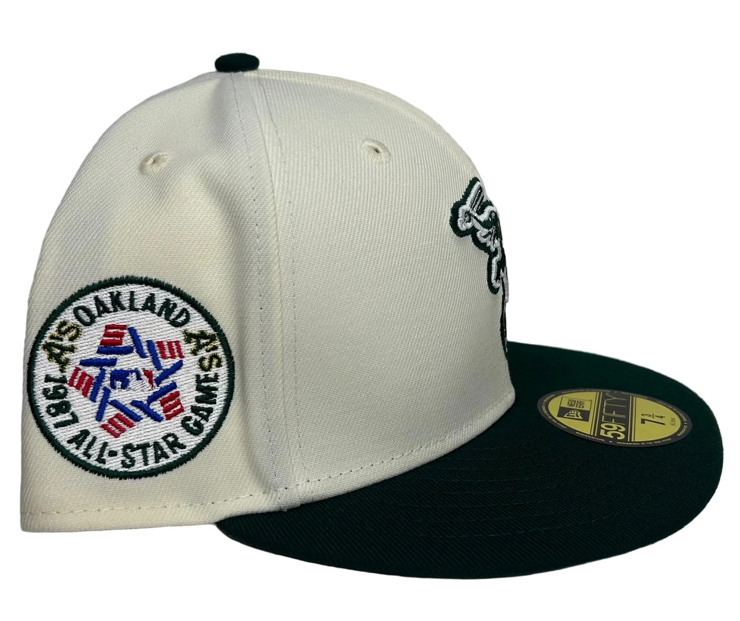 Off White Oakland Athletics 1987 All Star Game New Era 59Fifty Fitted hat featuring an off-white crown, dark green visor, and the classic elephant mascot logo on the front.