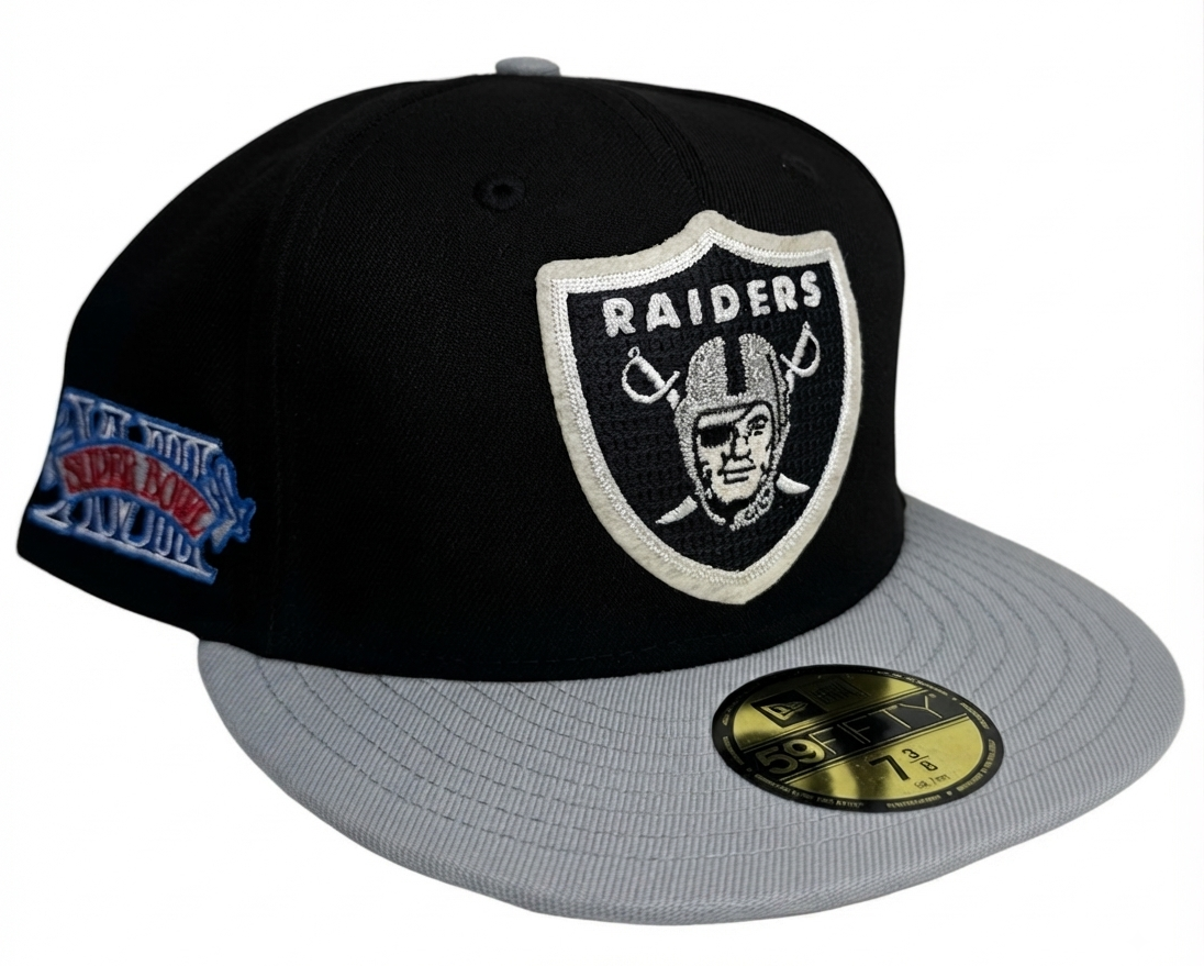 New Era Las Vegas Raiders Super Bowl XVIII Letterman 59FIFTY Fitted Hat featuring a classic black crown, contrasting grey flat brim, and a chenille letterman-style Super Bowl XVIII side patch.