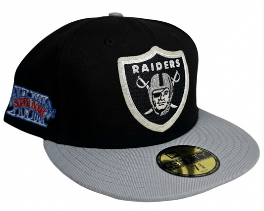 New Era Las Vegas Raiders Super Bowl XVIII Letterman 59FIFTY Fitted Hat featuring a classic black crown, contrasting grey flat brim, and a chenille letterman-style Super Bowl XVIII side patch.