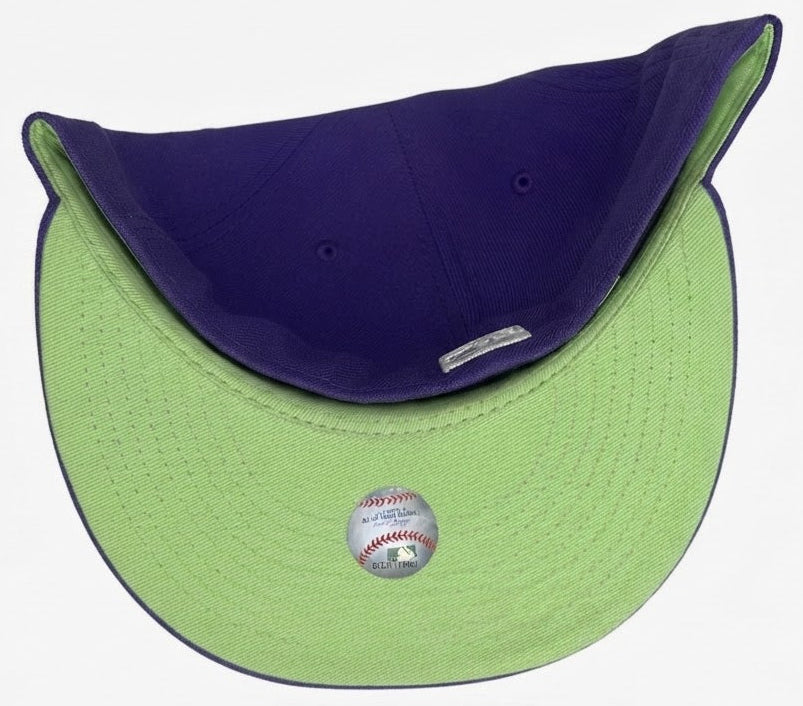 New Era Arizona Diamondbacks Citrus Pop 2001 World Series 59FIFTY fitted hat featuring a vibrant purple crown and a distinctive teal and copper embroidered team logo.