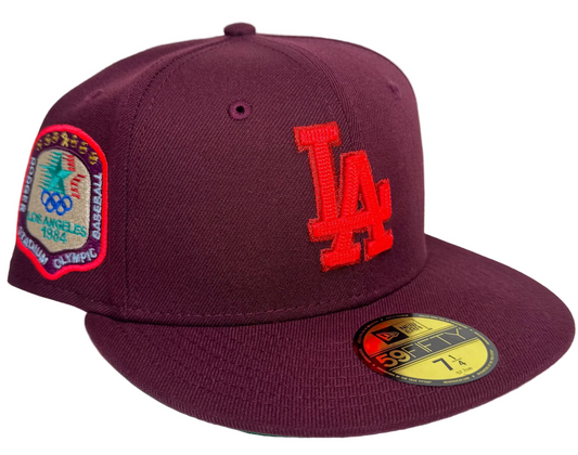 Maroon Los Angeles Dodgers 59FIFTY fitted hat from New Era's "Color Fam Lava" collection, featuring a vibrant red team logo and a commemorative 1984 Los Angeles Olympic side patch.