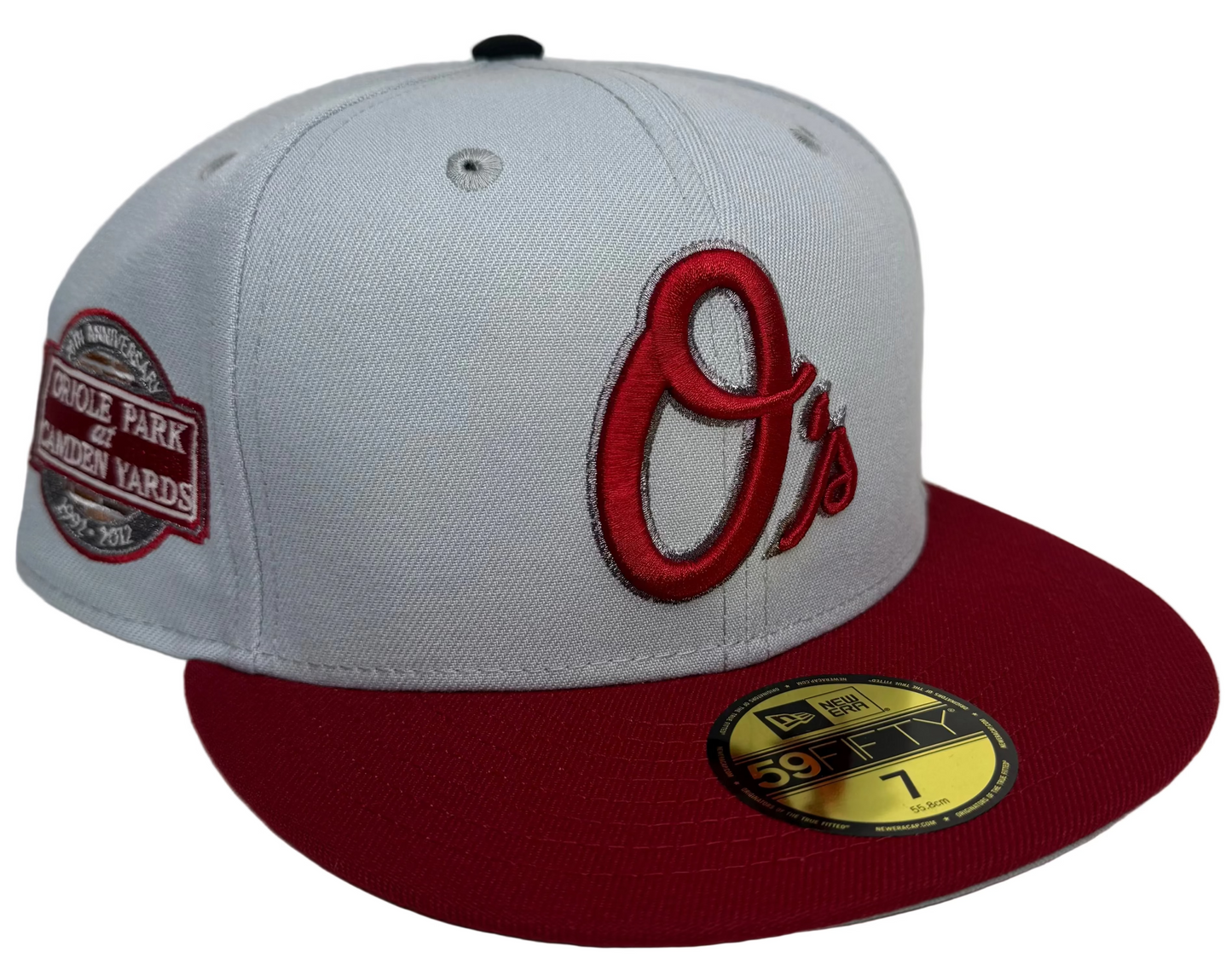 New Era 59Fifty Baltimore Orioles fitted hat featuring a light gray crown, a burgundy visor, and an Oriole Park at Camden Yards 20th anniversary side patch.