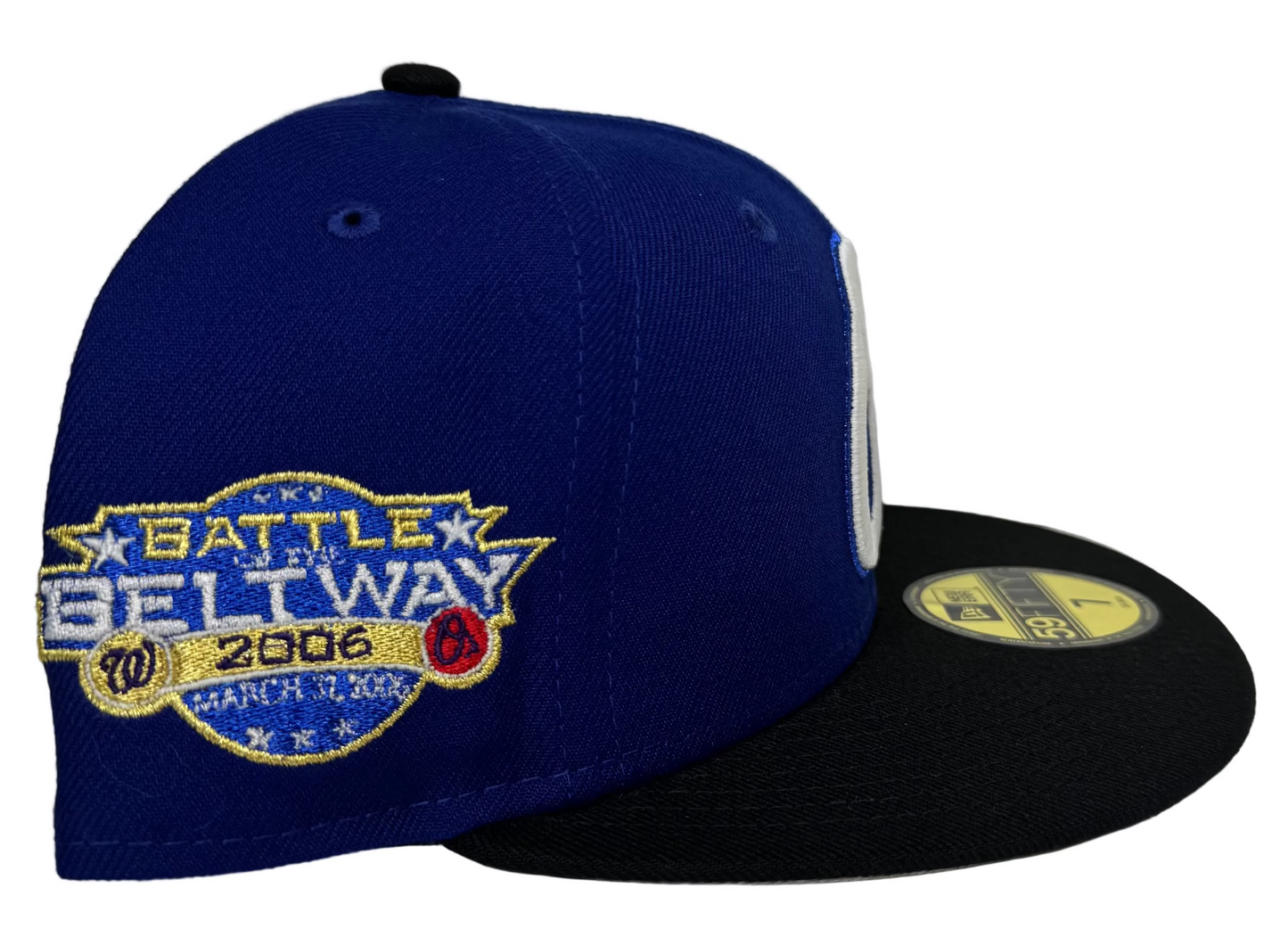 New Era 59FIFTY Baltimore Orioles fitted hat featuring a royal blue crown, a black flat brim, and a 2006 Battle of the Beltway side patch “Penny Foams” ATR By: T.V.B.