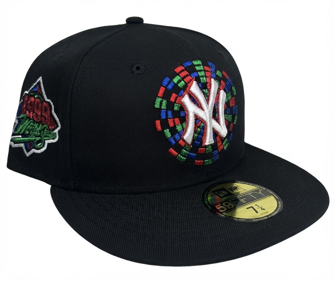 New Era New York Yankees 59FIFTY fitted hat featuring a black crown and a colorful embroidered circular side-and-front graphic with a 1999 World Series side patch
