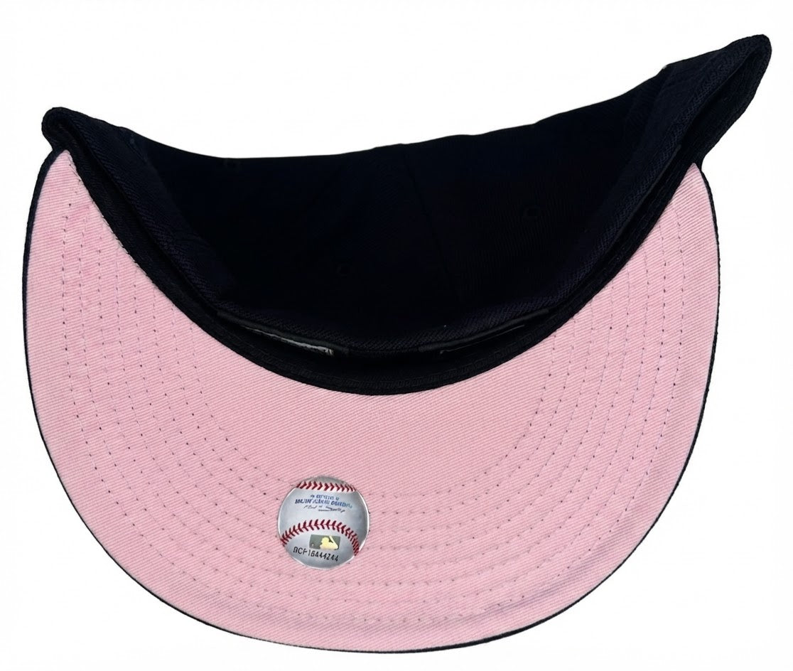 New Era New York Yankees 59FIFTY fitted hat featuring the embroidered 1999 World Series side patch on the right panel & a Pink UV.