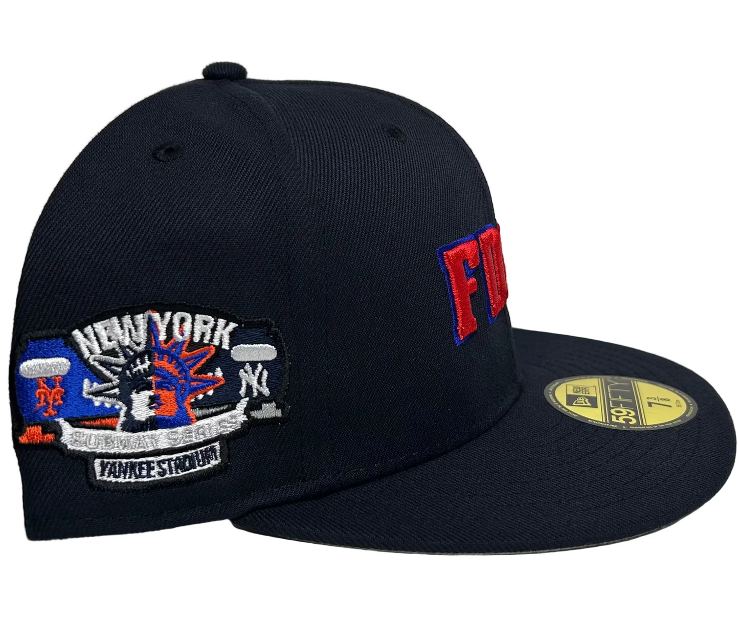 New Era 59FIFTY FDNY fitted hat featuring embroidered red and blue FDNY lettering on the front and a New York Yankees  stadium side patch/ Mets.