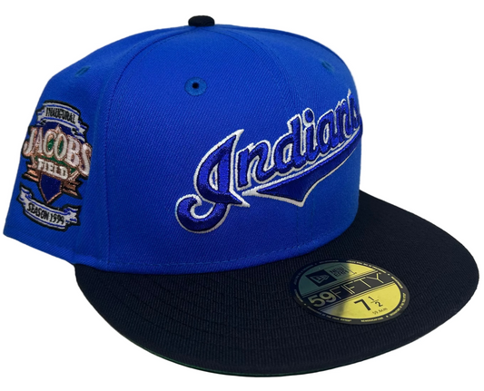 New Era 59FIFTY fitted Hat featuring a  Cleveland Indians, royal blue crown, a navy blue visor, a green undervisor, and an Inaugural Season 1994 Jacobs Field side patch for the Cleveland Indians.
