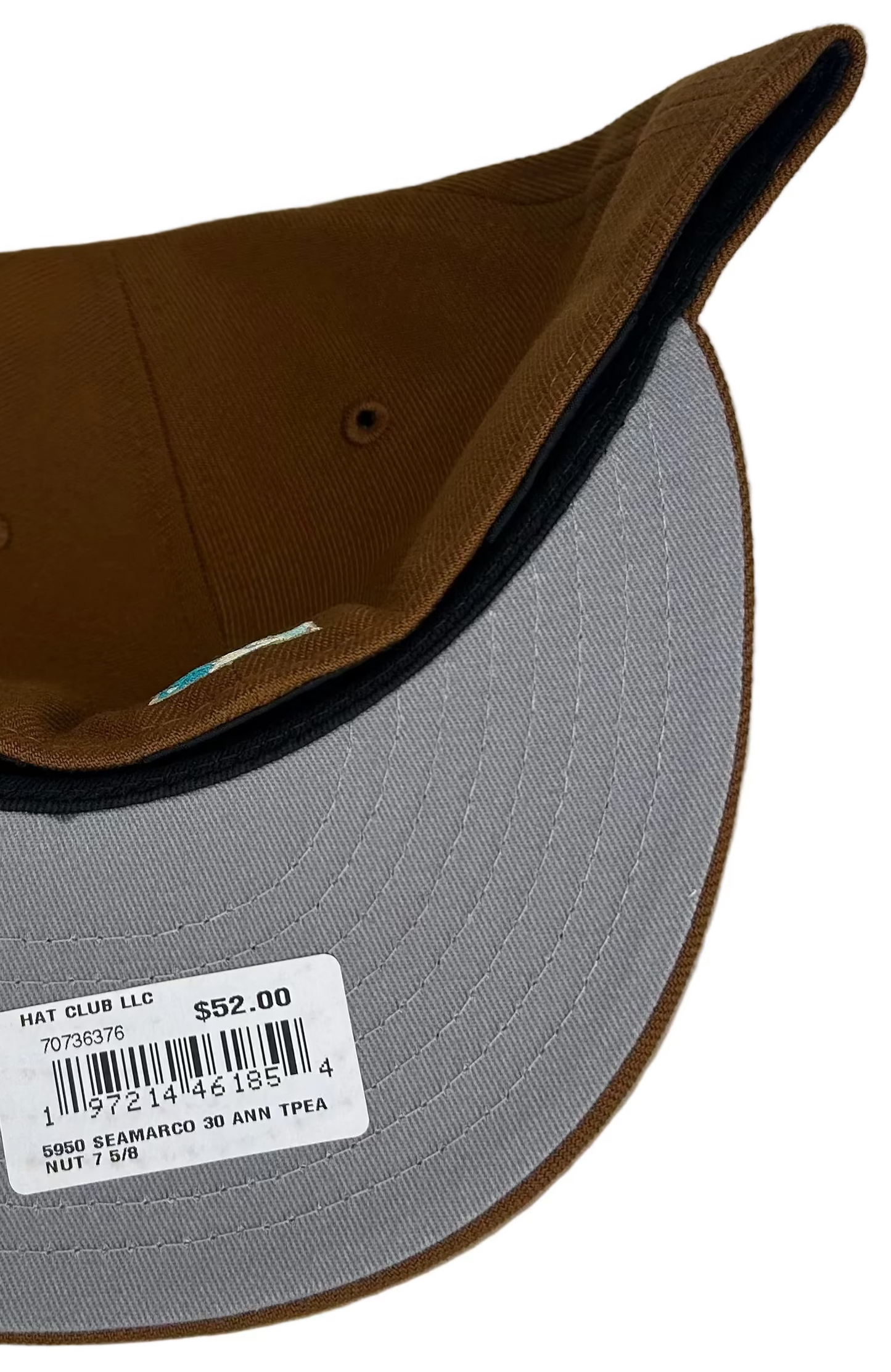 New Era 59FIFTY Seattle Mariners fitted hat featuring a vibrant teal compass logo on the front and a 30th-anniversary side patch.