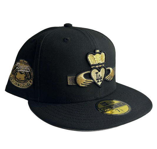 New Era 59FIFTY Los Angeles Dodgers “Kings” fitted hat with a Claddagh symbol and gold accents.