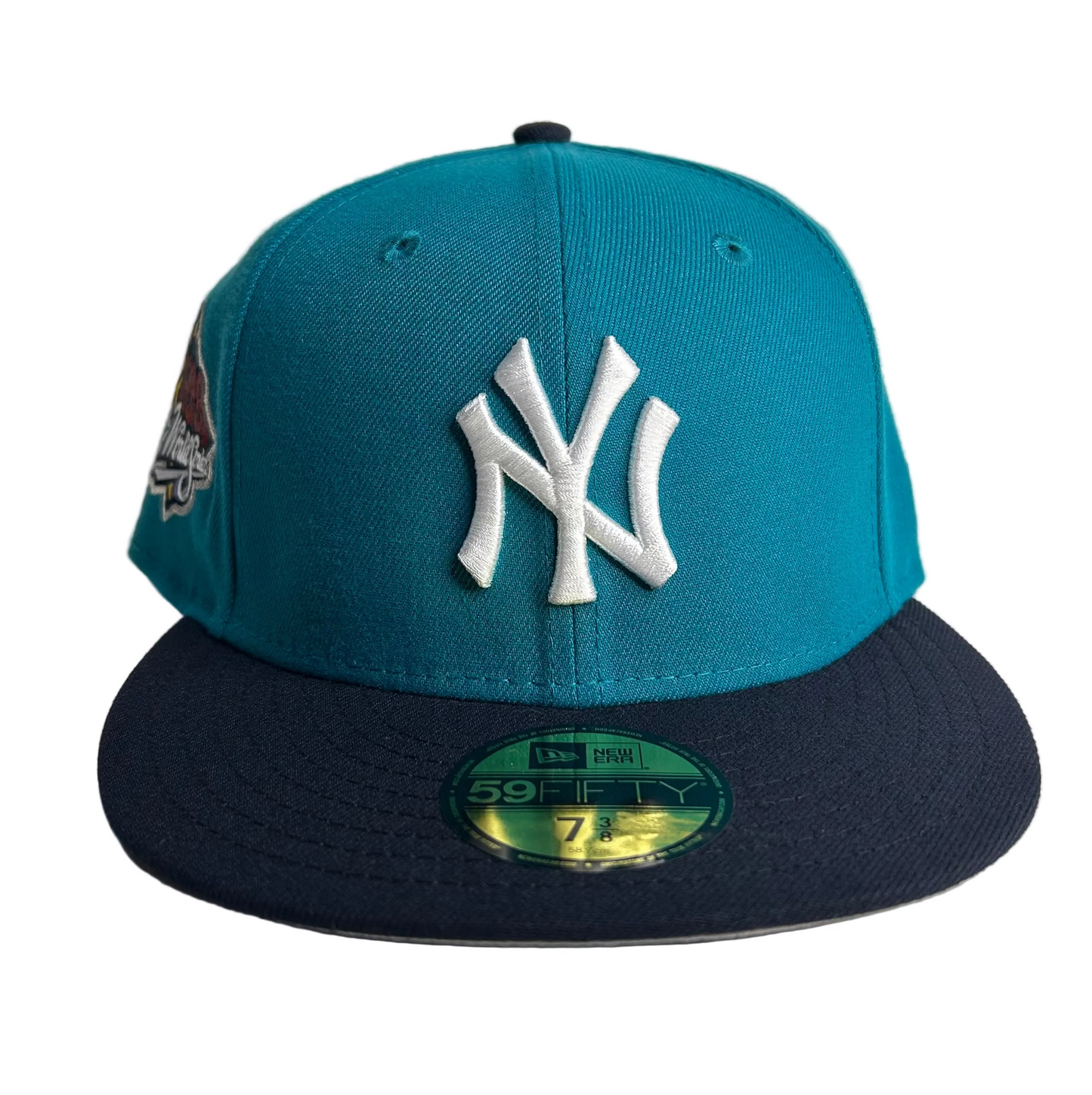 New Era 59FIFTY New York Yankees 1999 World Series fitted hat in a Teal 2-Tone Navy W/ Gray UV colorway. 
