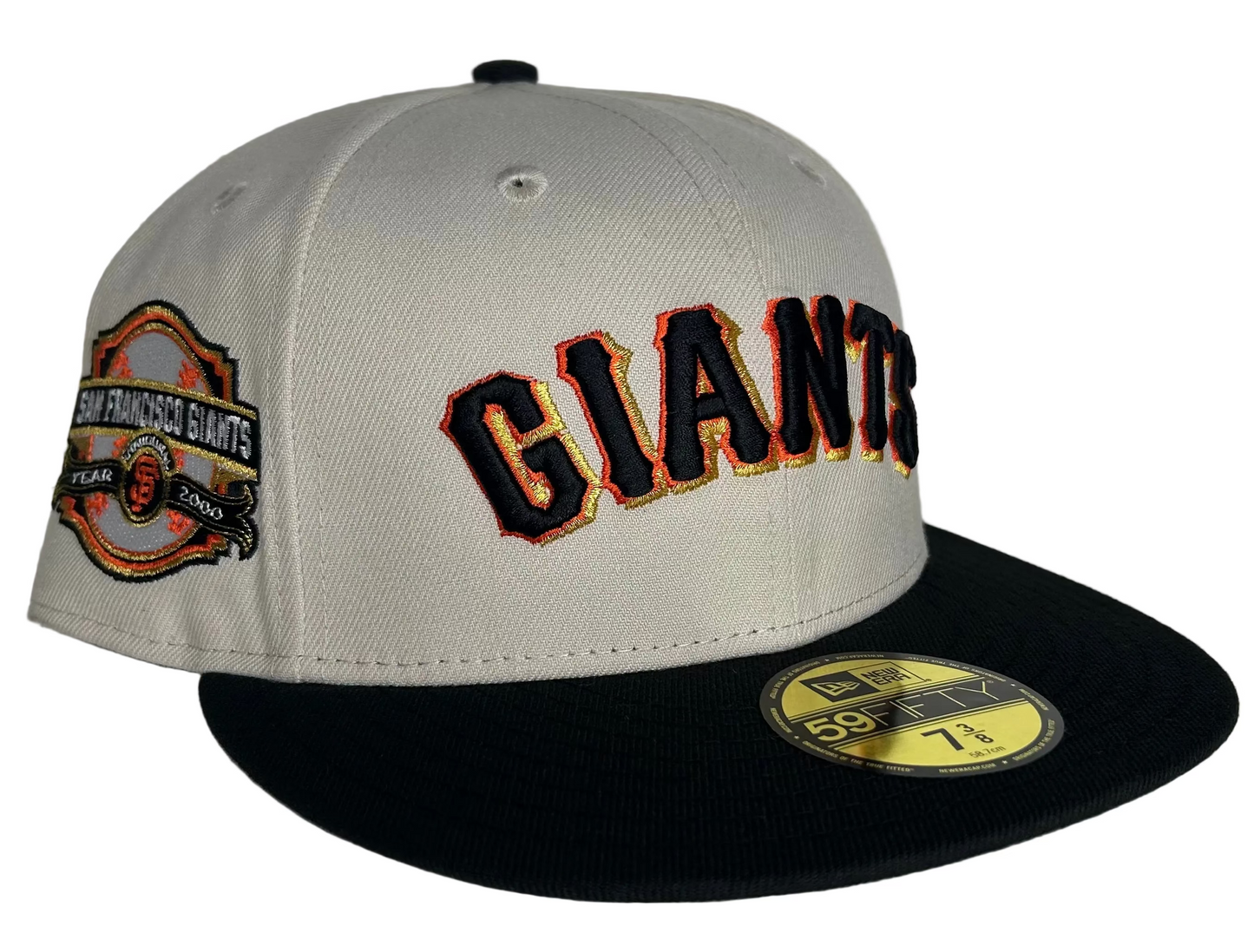 New Era San Francisco Giants 59FIFTY fitted cap featuring a cream crown, black brim, and a "2000 Inaugural Year" side patch W/ Green UV.