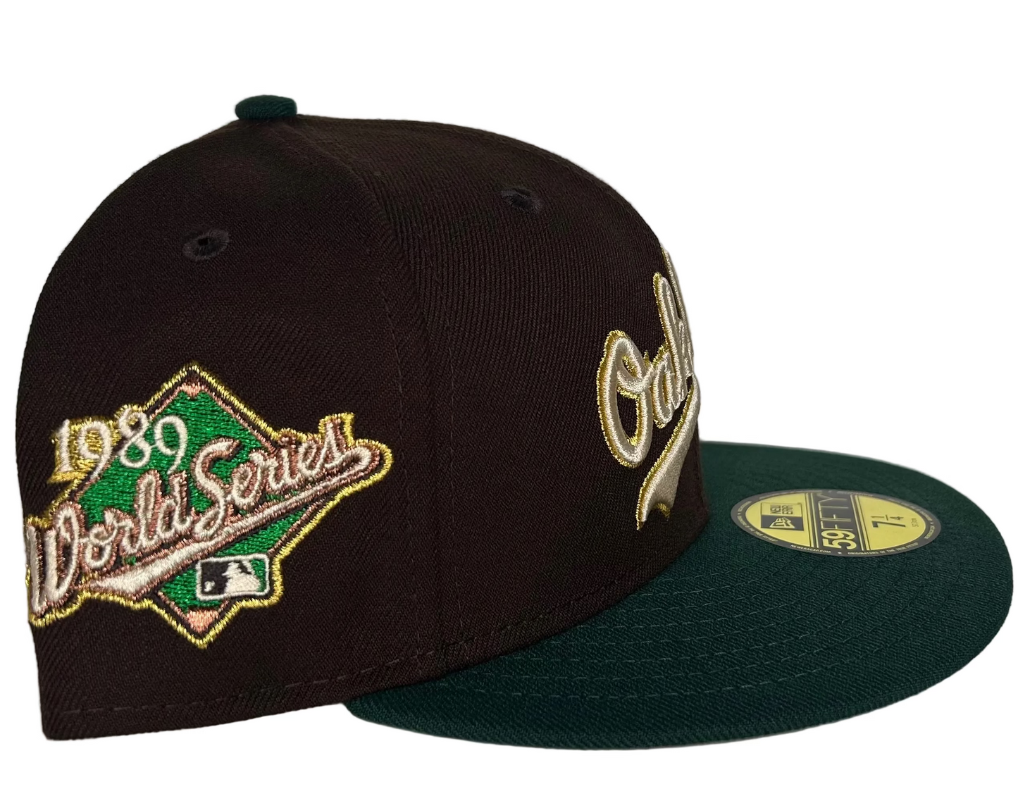 New Era Oakland Athletics Script Coliseum  “Milky Way” 59FIFTY Fitted Hat, which features a throwback two-tone design with a script logo on the front and a World Series patch on the side. 