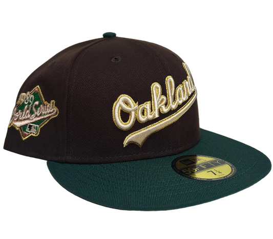 New Era Oakland Athletics Script Coliseum  “Milky Way” 59FIFTY Fitted Hat, which features a throwback two-tone design with a script logo on the front and a World Series patch on the side. 