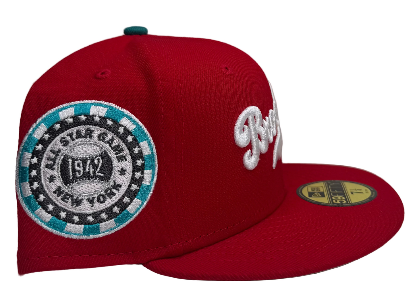 New Era 59Fifty fitted hat in Scarlet Red w/ Gray undervisor, featuring the "Brooklyn" script logo on the front and a 1942 All-Star Game side patch.