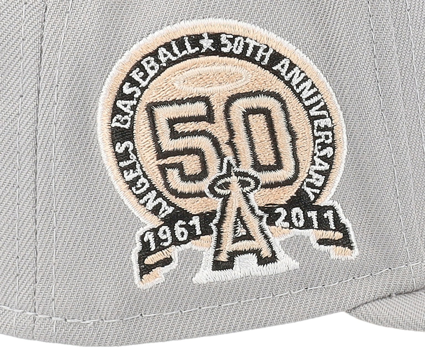 New Era Los Angeles Angels Feather 59FIFTY Fitted Cap featuring a gray crown, peach-colored detailing, and a 50th-Anniversary side patch. 