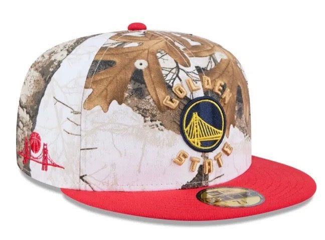 New Era Warriors Realtree Camo 59FIFTY fitted hat features a camouflage pattern and red visor. 