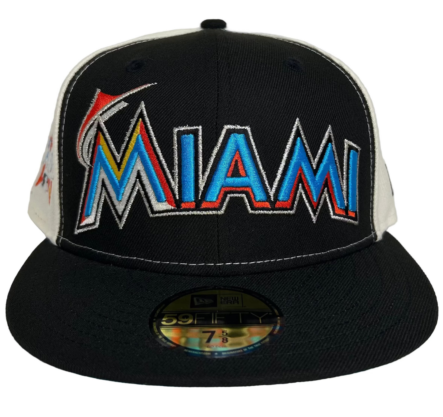 Miami Marlins New Era 59FIFTY Fitted Hat. It features the team's "MIAMI" wordmark logo in a vibrant multi-colored embroidery on the front.