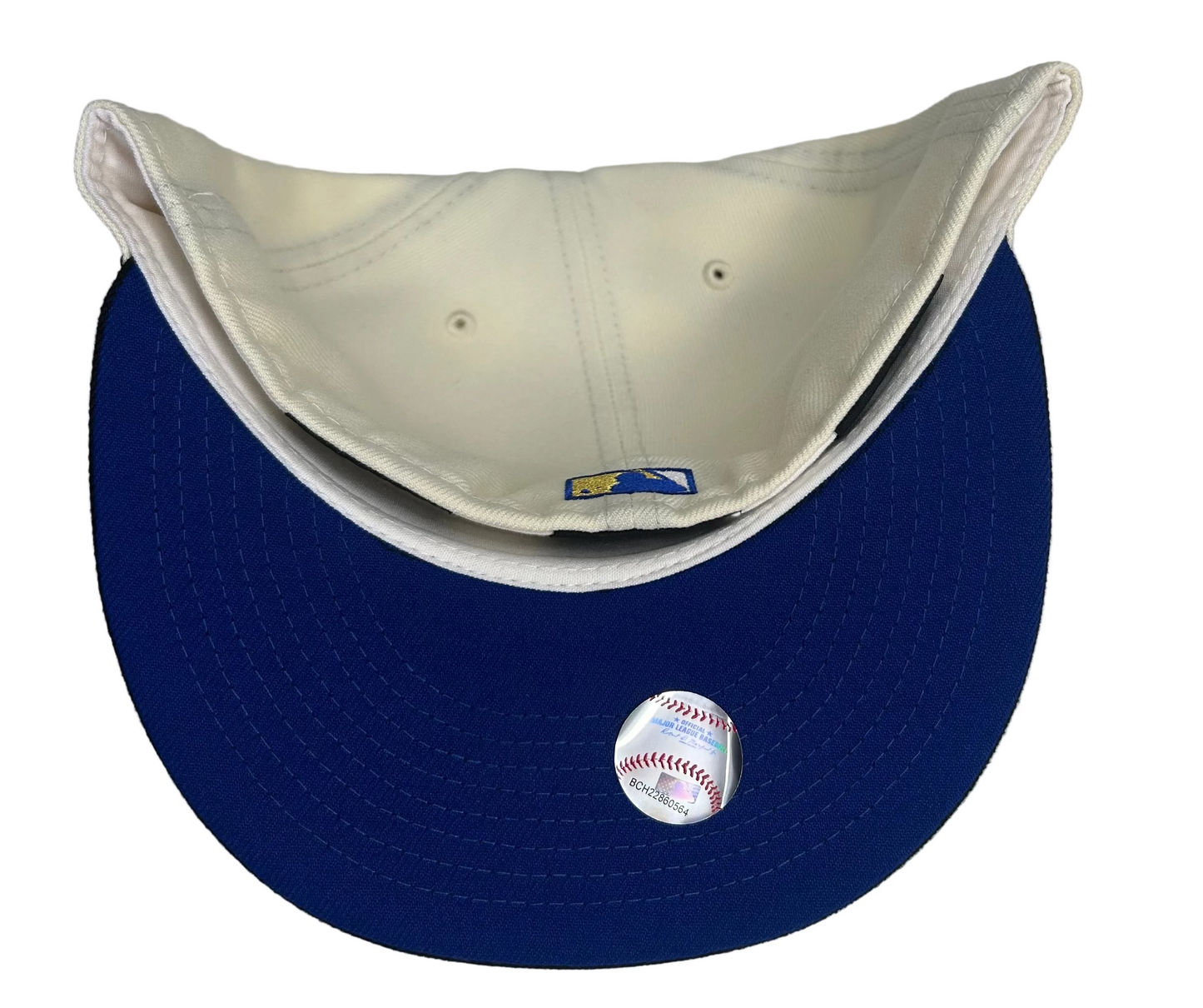 Kansas City Royals 59FIFTY fitted hat is produced by New Era and features a two-tone design with an off-white crown and a black brim. 