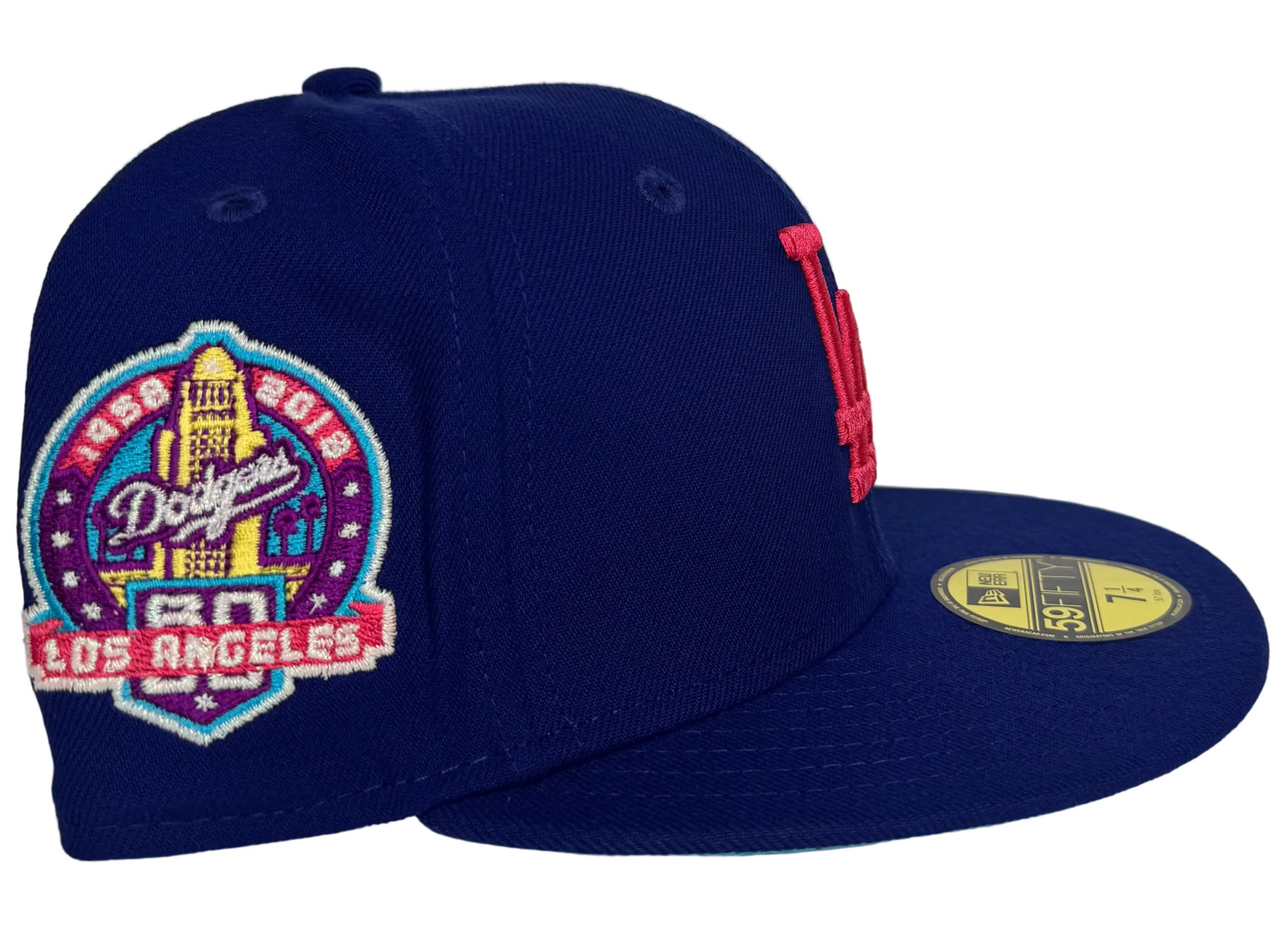 New Era 59FIFTY Los Angeles Dodgers Fitted Hat in a royal blue colorway featuring a Hot Pink embroidered "LA" logo.