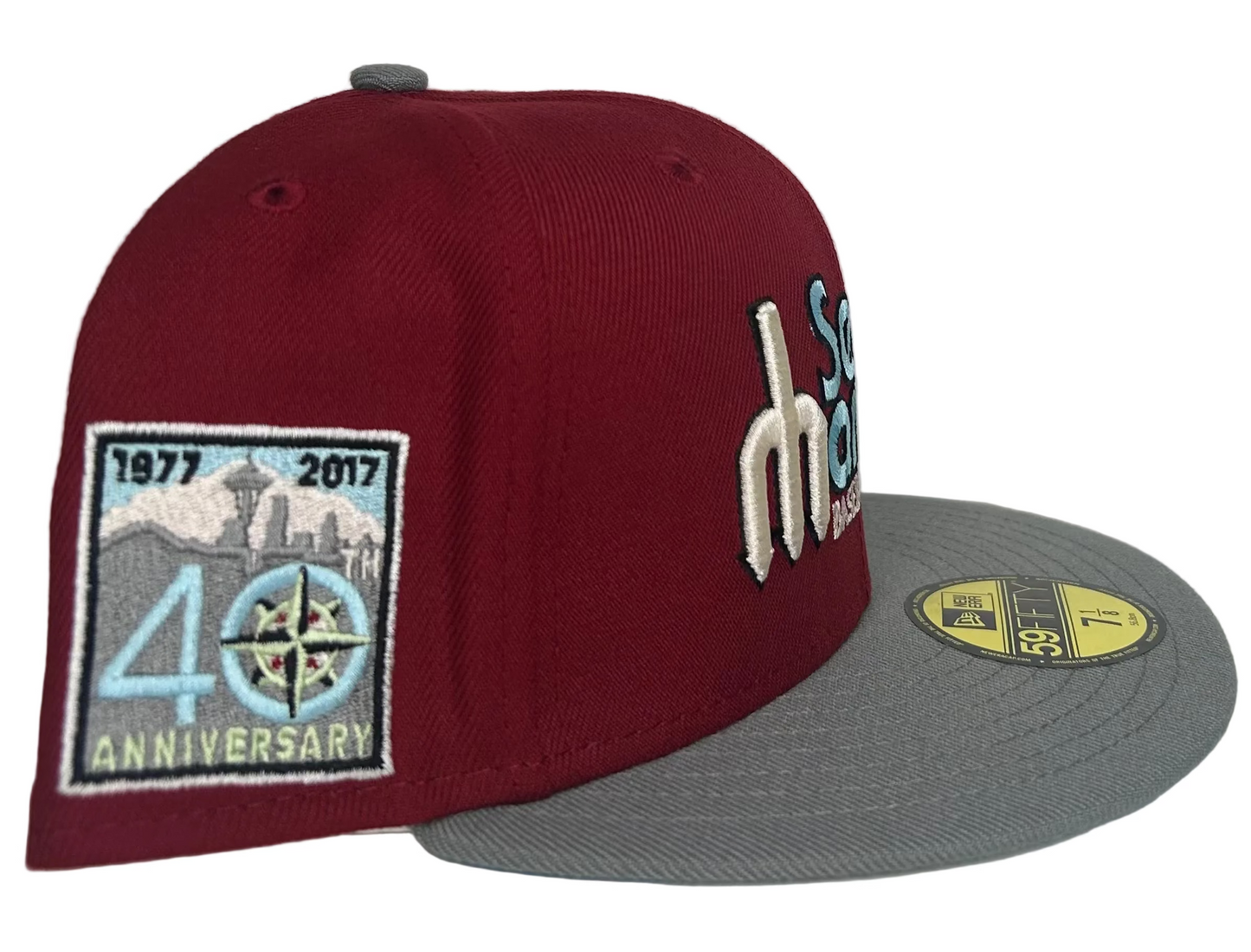 New Era 59FIFTY Seattle Mariners Baseball Club 40th Anniversary fitted hat featuring a burgundy/red lid, baby blue script lettering, & Icy Blue UV.