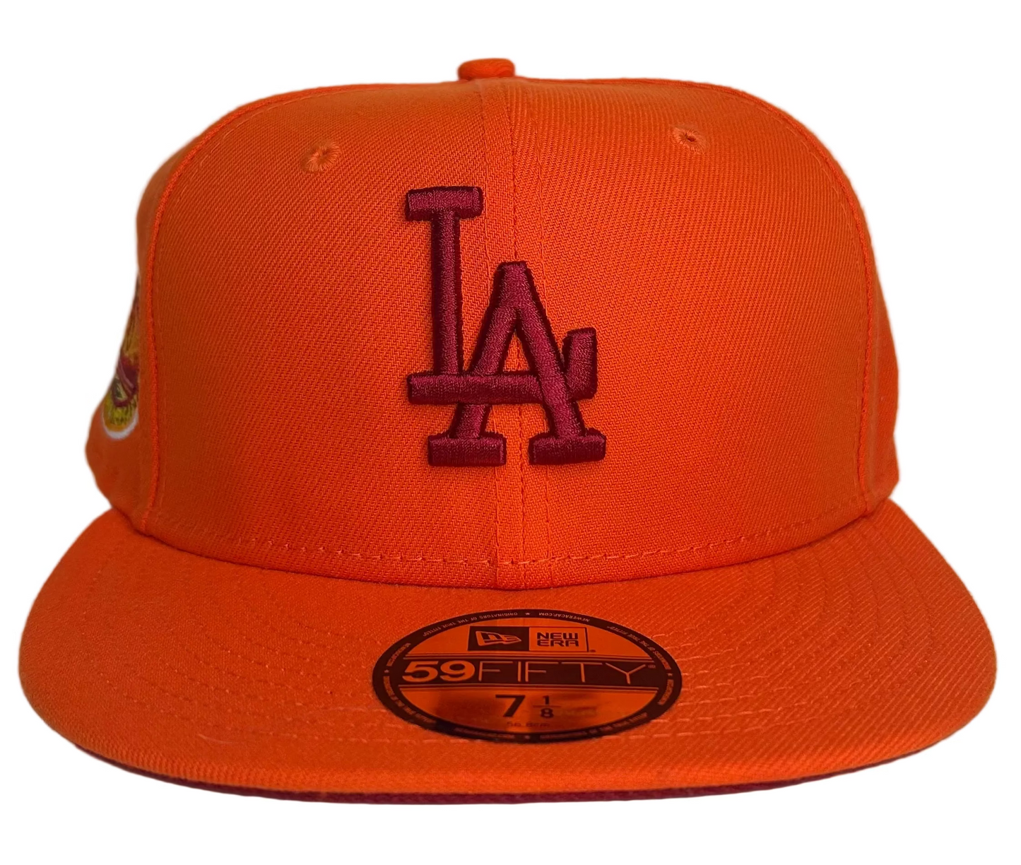 New Era Los Angeles Dodgers HC 59FIFTY fitted hat featuring a bright orange color scheme and a special anniversary side patch. 