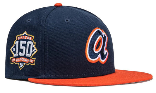Atlanta Braves New Era 59FIFTY fitted hat, specifically featuring a navy crown, orange visor, and a 150th Anniversary side patch. 