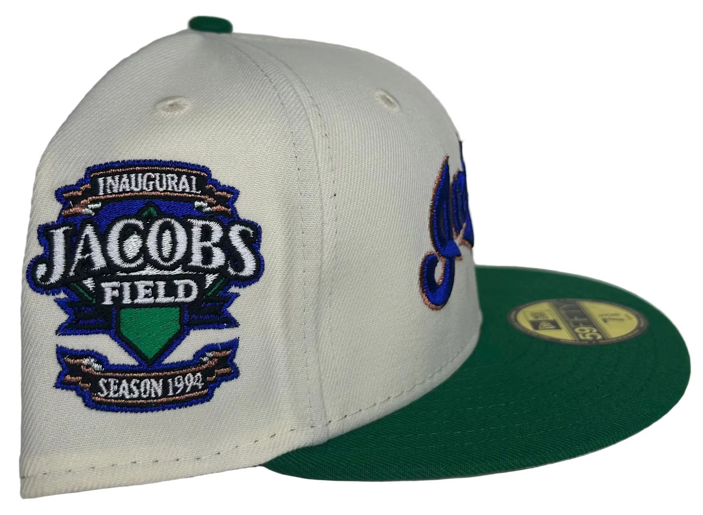New Era Cleveland Indians 59FIFTY fitted hat, featuring a cream crown, green brim, and a patch commemorating the 1994 inaugural season at Jacobs Field. 
