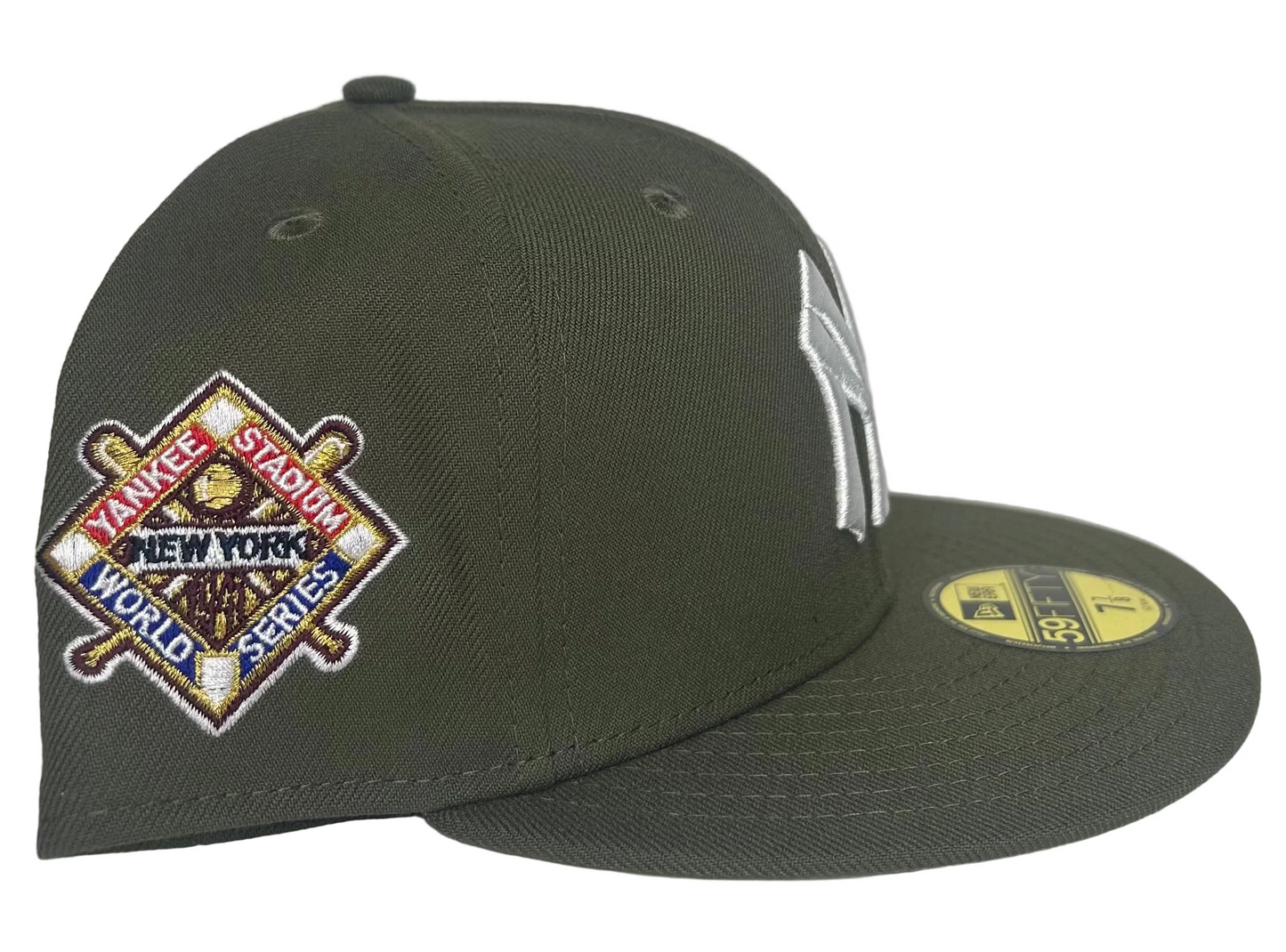 New Era New York Yankees 59FIFTY fitted cap, featuring a distinctive olive color and a World Series side patch. 