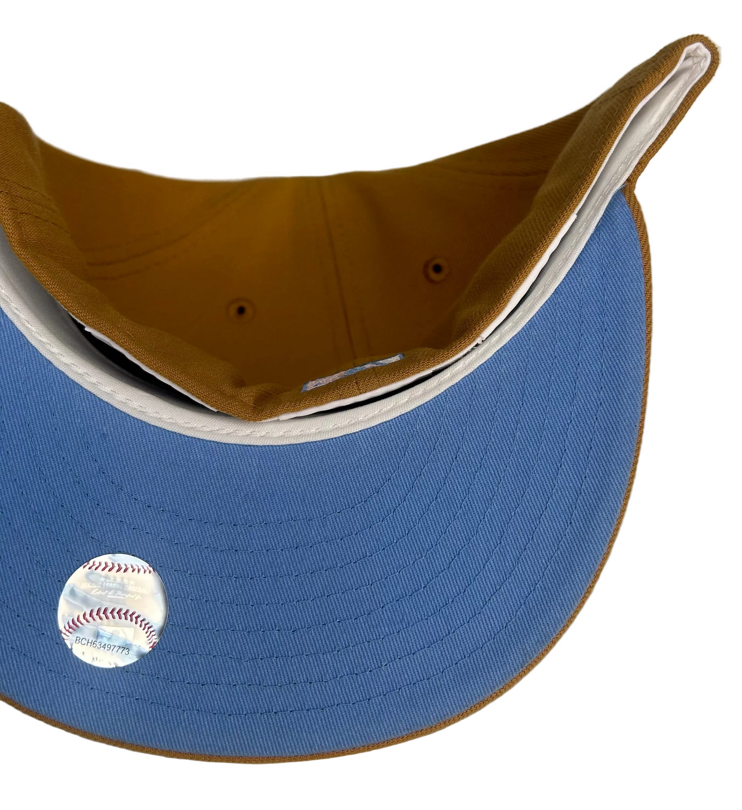 New Era Philadelphia Phillies 59FIFTY fitted hat featuring a tan crown, light blue logo, and a special side patch.