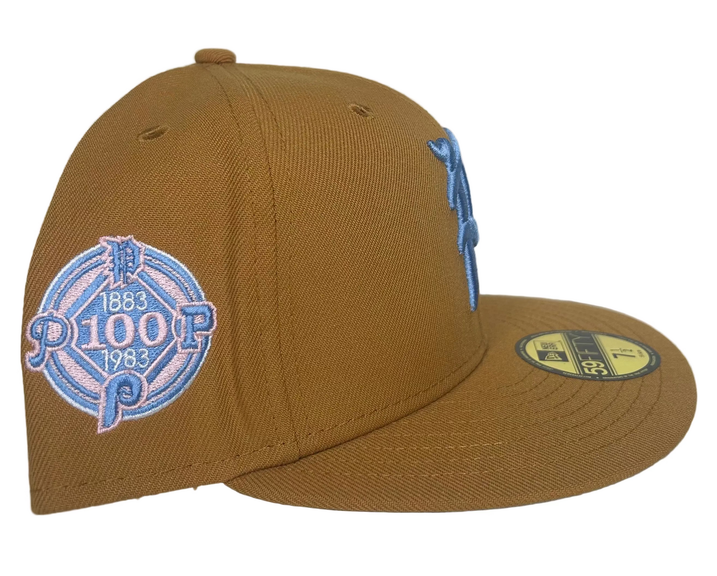 New Era Philadelphia Phillies 59FIFTY fitted hat featuring a tan crown, light blue logo, and a special side patch.