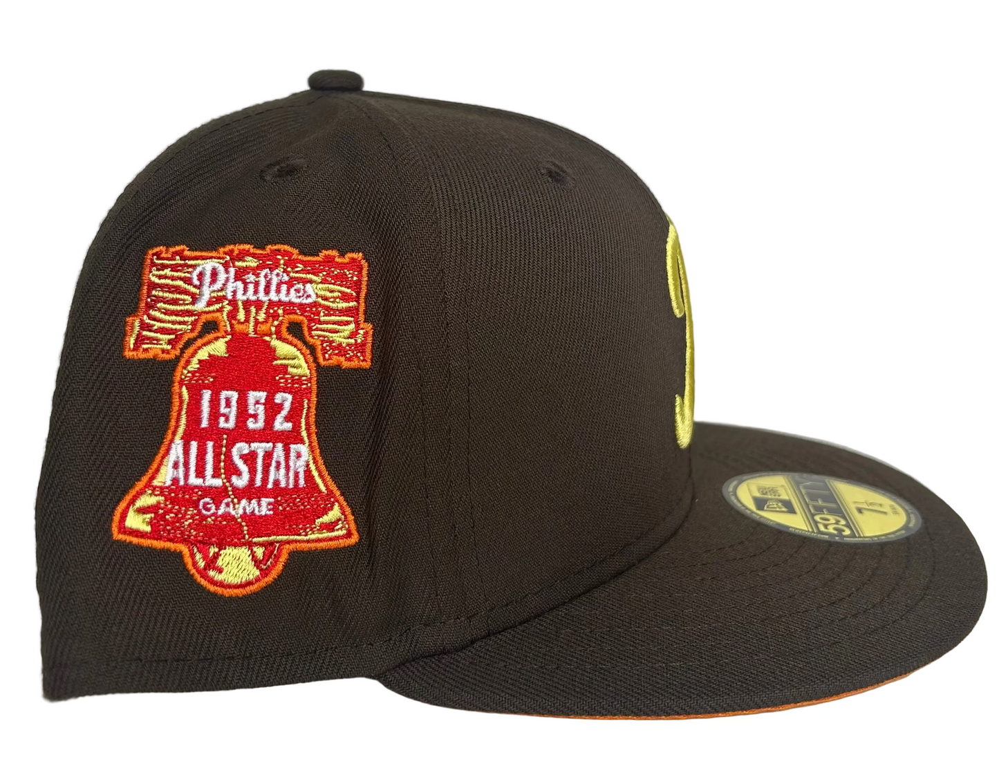New Era Philadelphia Phillies 59FIFTY fitted hat featuring a brown crown, a yellow 'P' logo, and a 1952 All-Star Game patch. 