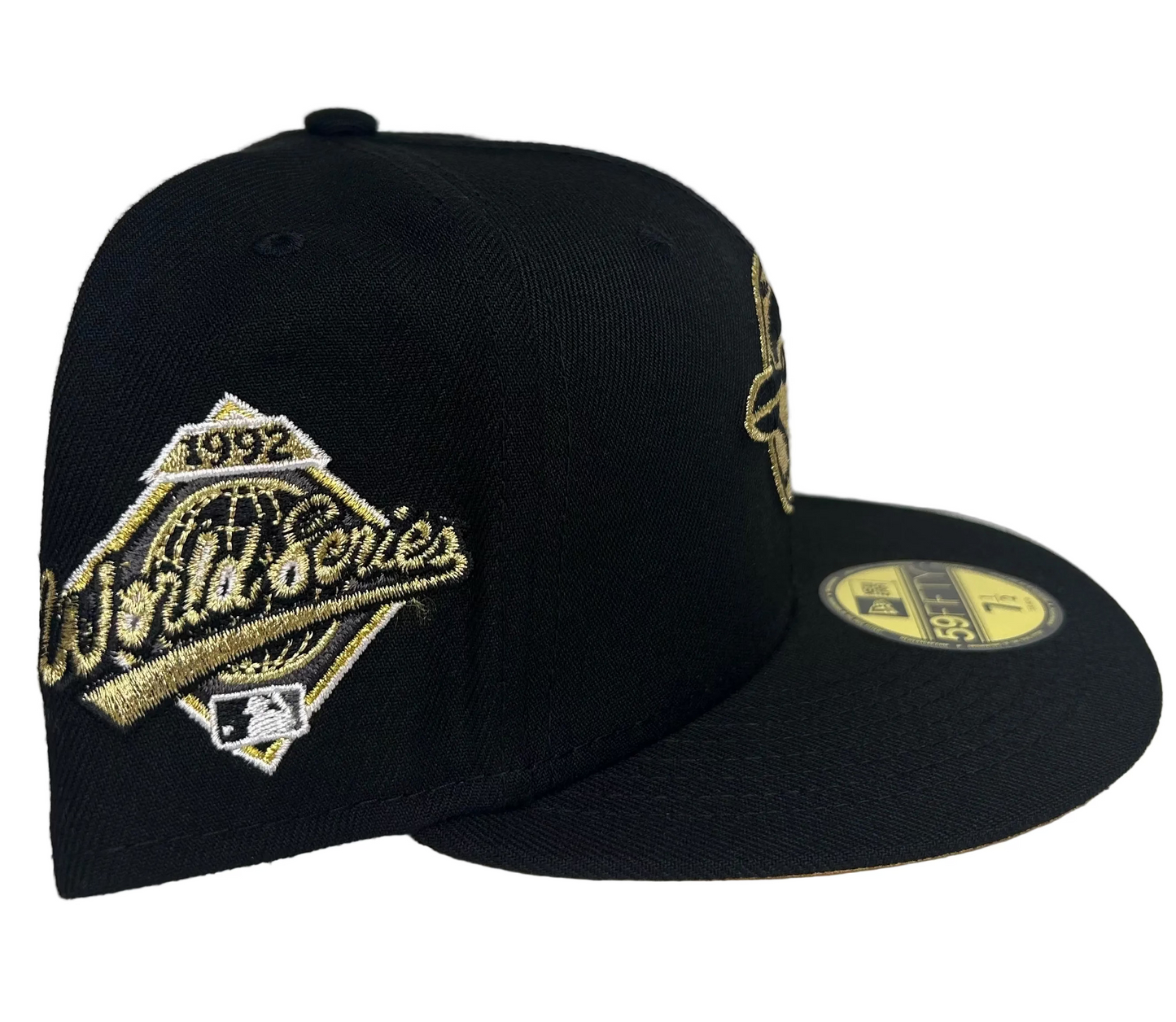 New Era Toronto Blue Jays 59FIFTY fitted hat featuring a black crown and metallic gold embroidery