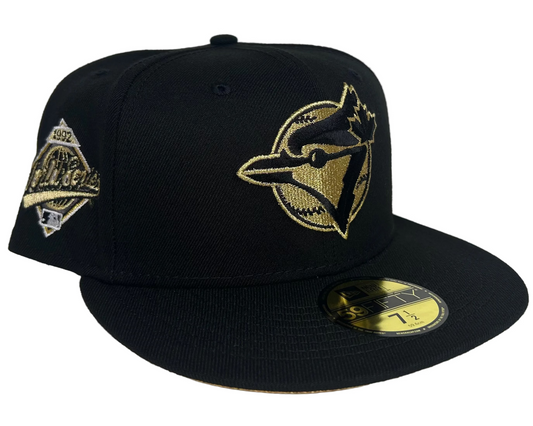 New Era Toronto Blue Jays 59FIFTY fitted hat featuring a black crown and metallic gold embroidery