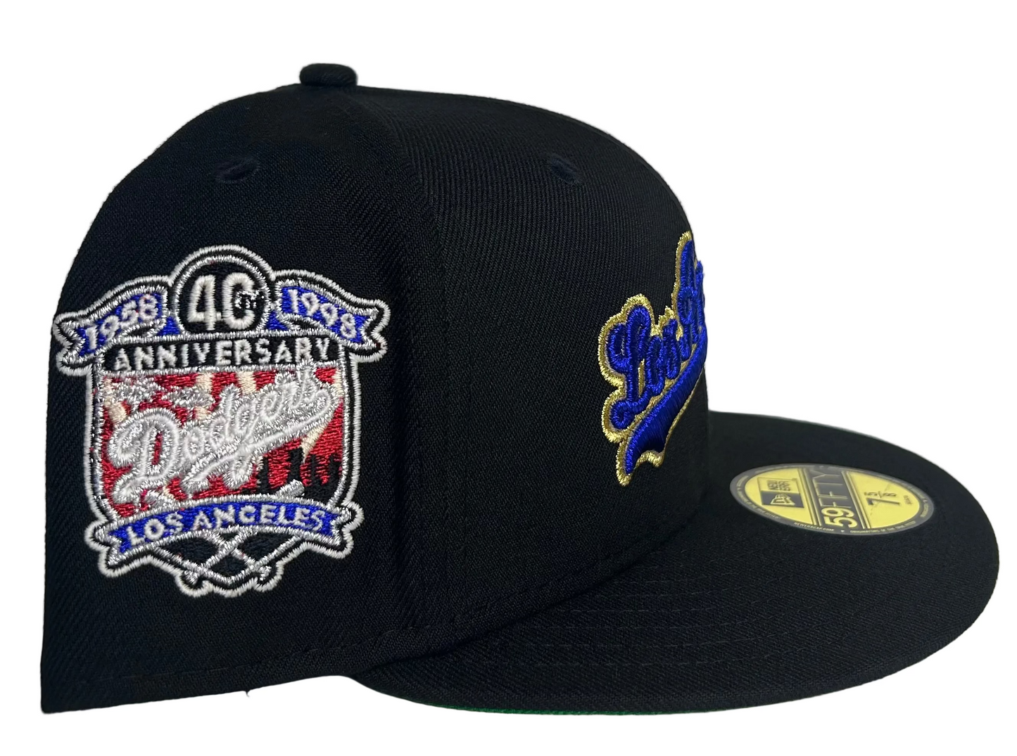 New Era Los Angeles Dodgers 59Fifty fitted cap featuring a black crown, royal blue and gold script lettering, and a commemorative side patch.