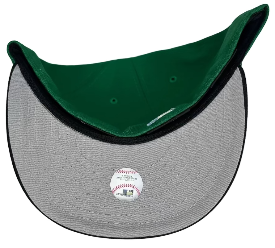 New Era Tampa Bay Rays 59FIFTY fitted hat featuring a green crown, black visor, and a Tropicana Field side patch.